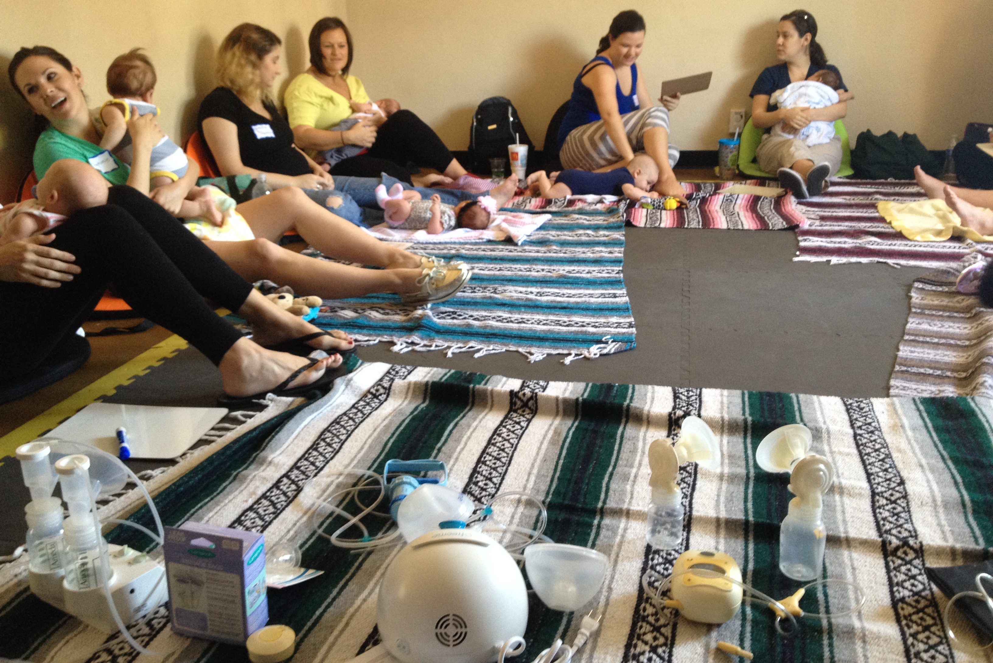 Moms Learning About Breastfeeding at A Babymoon Inn Back To Work Class for new moms