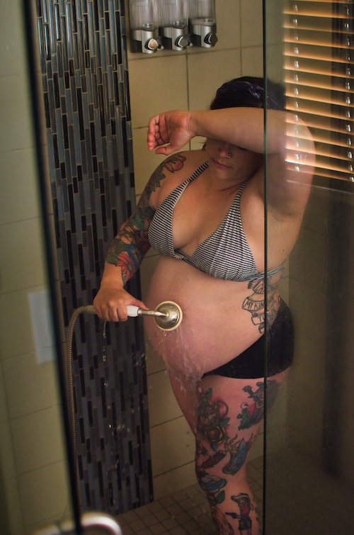 A woman labors in the shower at a freestanding birth center.